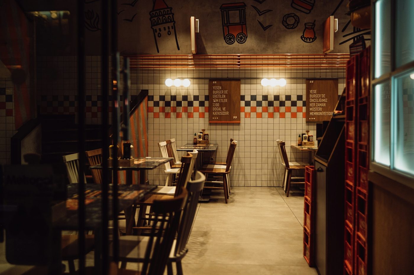 An empty tiled restaurant dining room