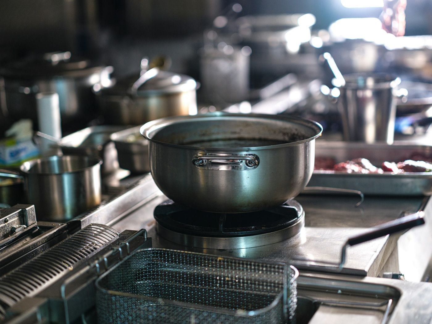 Stainless pots on a clean commercial range