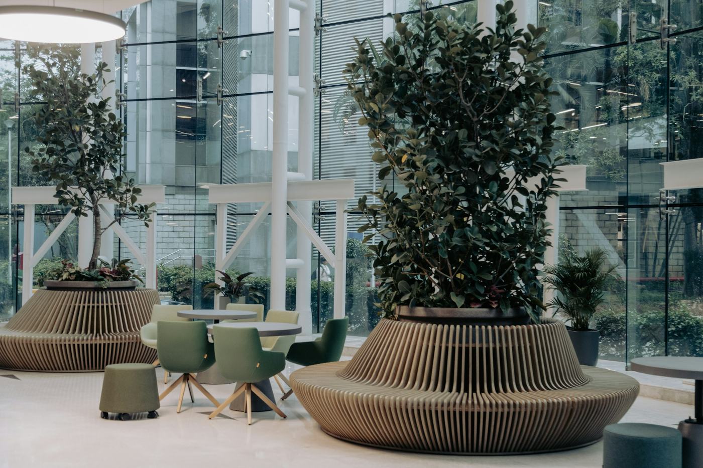 A bright office lobby with seating and planters
